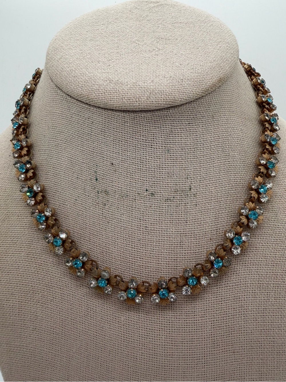 Vintage gold tone blue and clear rhinestone flower necklace